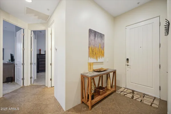 a view of a bedroom with a door and a bathroom