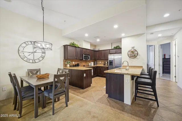 a kitchen with a table and chairs in it