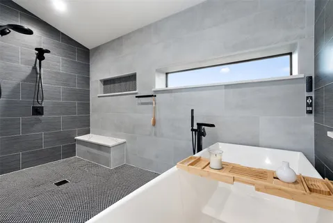 a bathroom with a bathtub and toilet