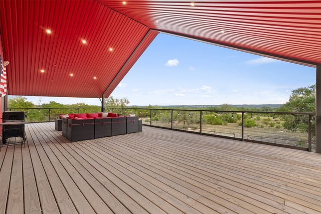a view of a deck with wooden floor and outdoor space