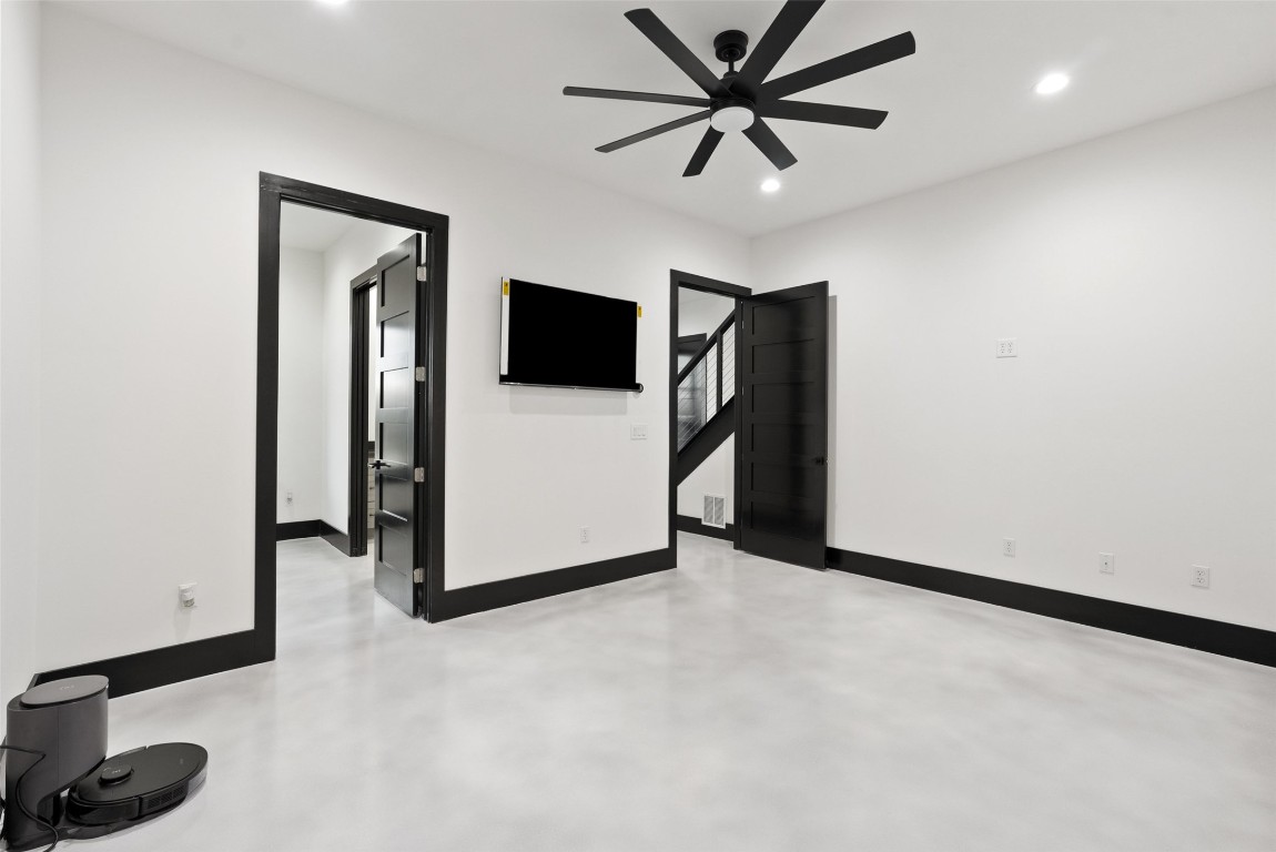 561 Broken Bit Trail Dripping Springs, TX 78620 - Photo 20 of 40 a view of a livingroom with a flat screen tv