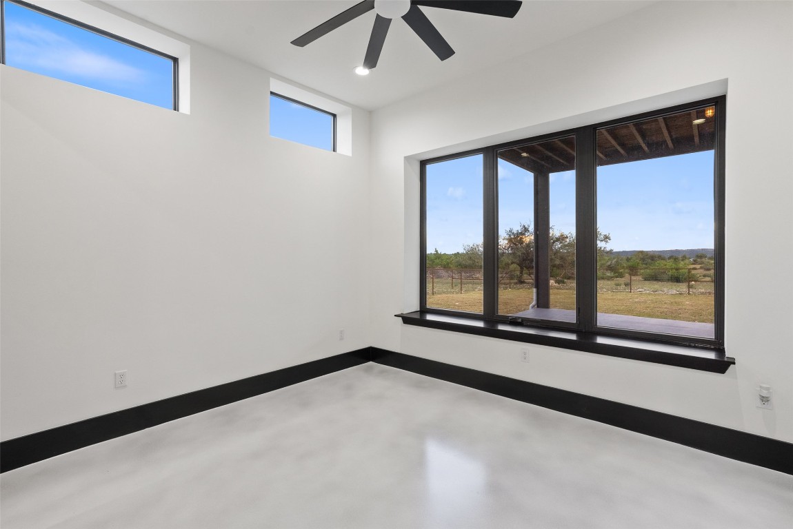 561 Broken Bit Trail Dripping Springs, TX 78620 - Photo 23 of 40 a view of an empty room with a window