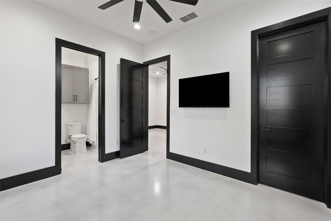 561 Broken Bit Trail Dripping Springs, TX 78620 - Photo 24 of 40 a view of a livingroom with a flat screen tv
