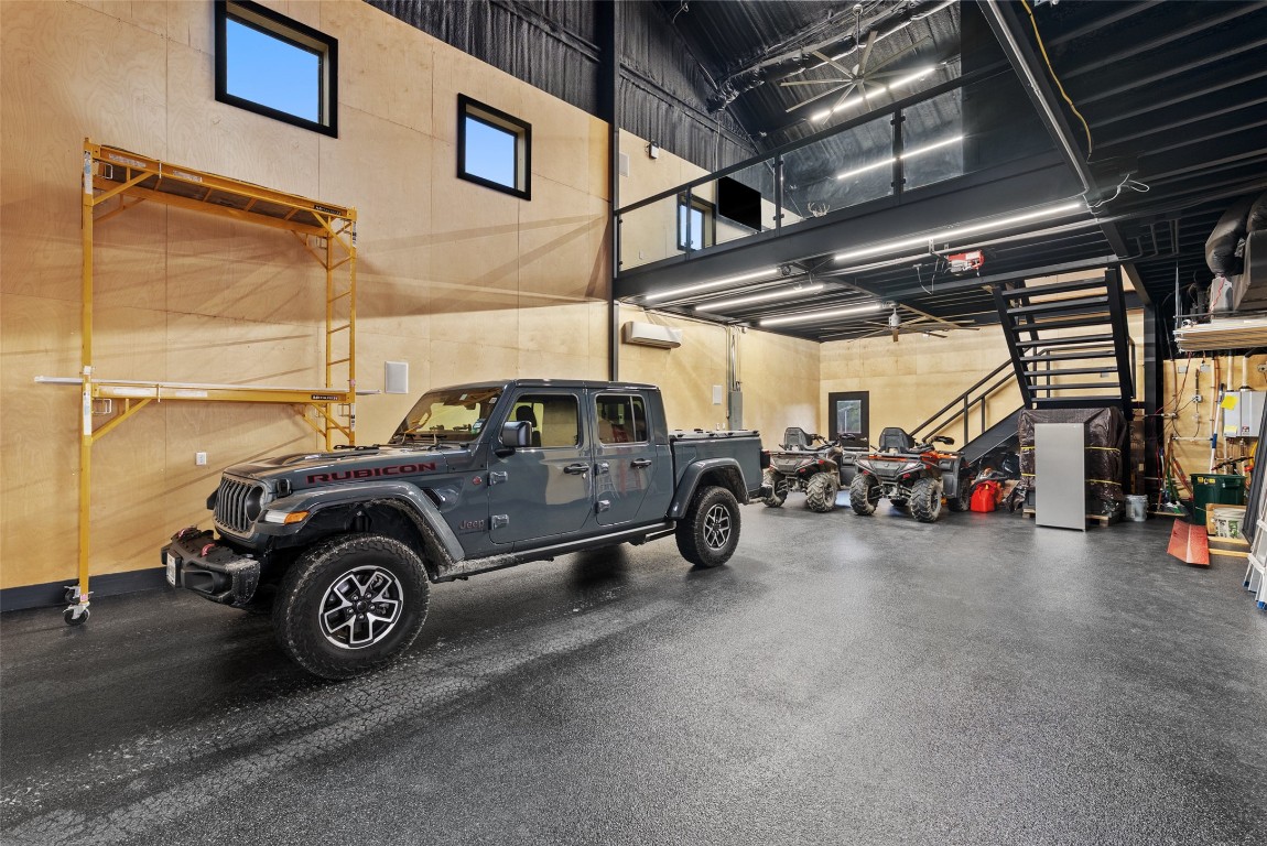 561 Broken Bit Trail Dripping Springs, TX 78620 - Photo 30 of 40 a view of a car in garage