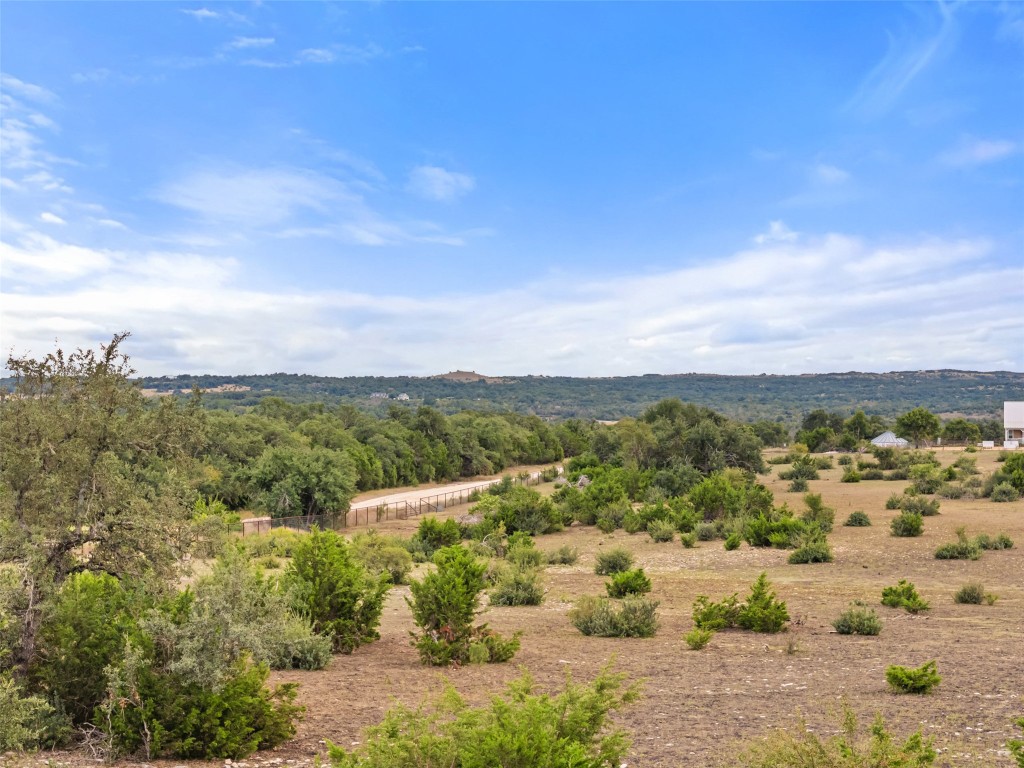 561 Broken Bit Trail Dripping Springs, TX 78620 - Photo 38 of 40 a view of lake with mountain