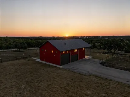 a open kitchen with stainless steel appliances granite countertop a stove and a view of living room