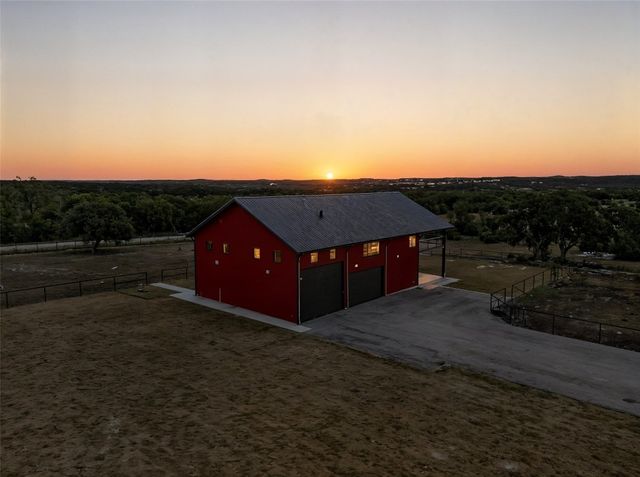 a open kitchen with stainless steel appliances granite countertop a stove and a view of living room