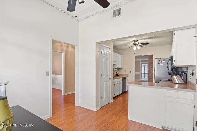 a view of a kitchen from the hallway