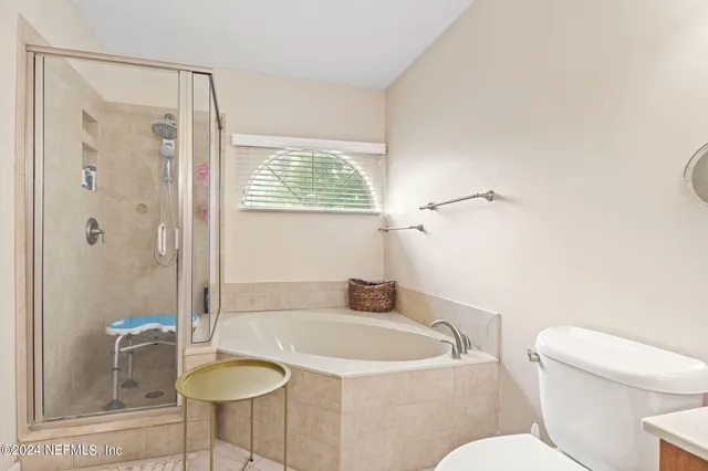 a bathroom with a sink toilet a shower and bathtub