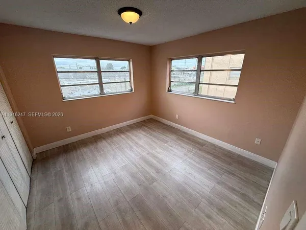 an empty room with windows