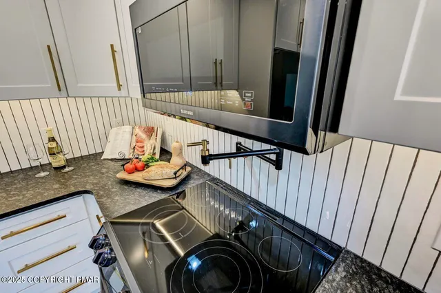 a kitchen with a table and chairs in it