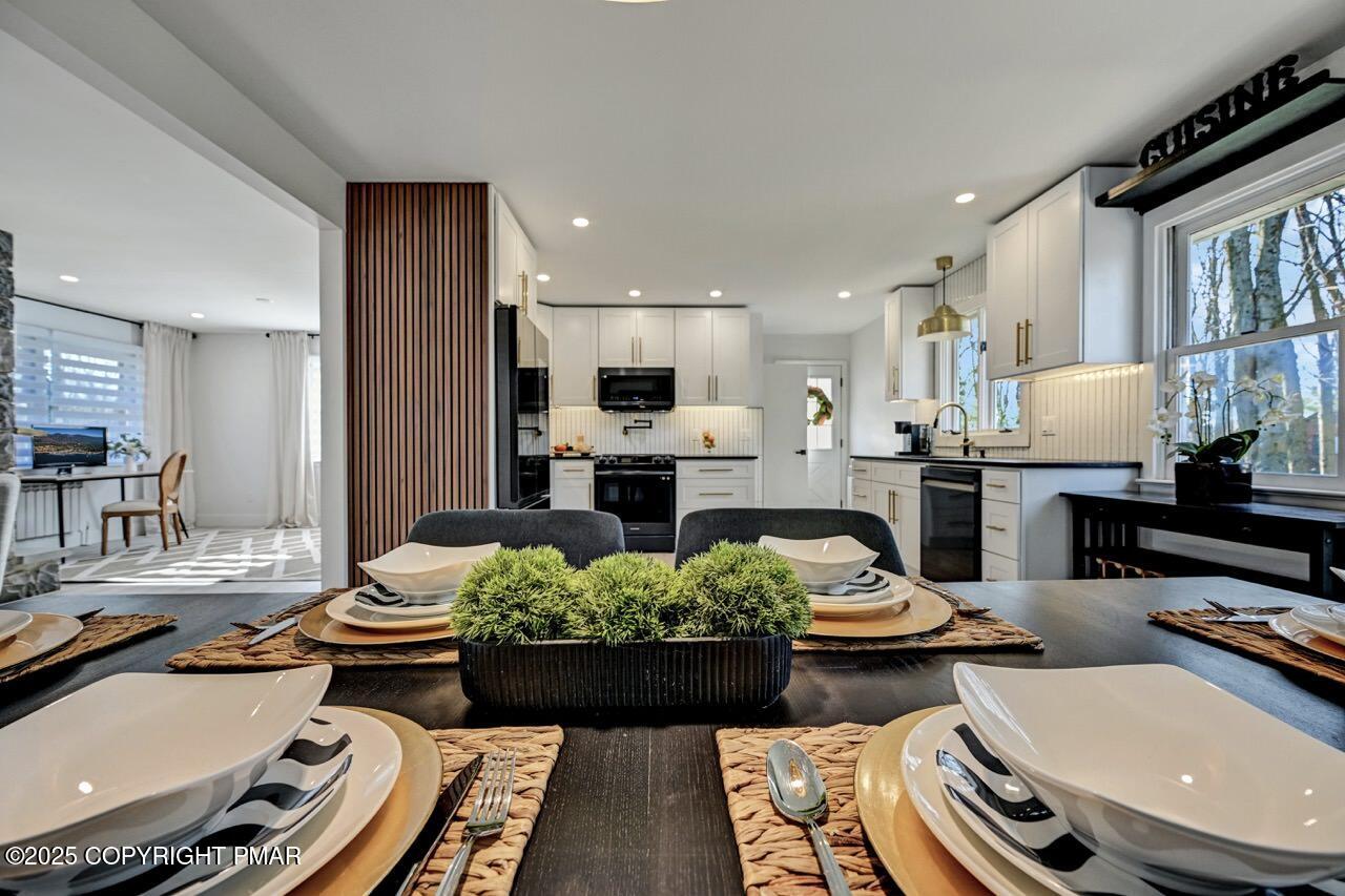 205 Winona Road Mount Pocono, PA 18344 - Photo 15 of 47 a kitchen with a table and chairs in it