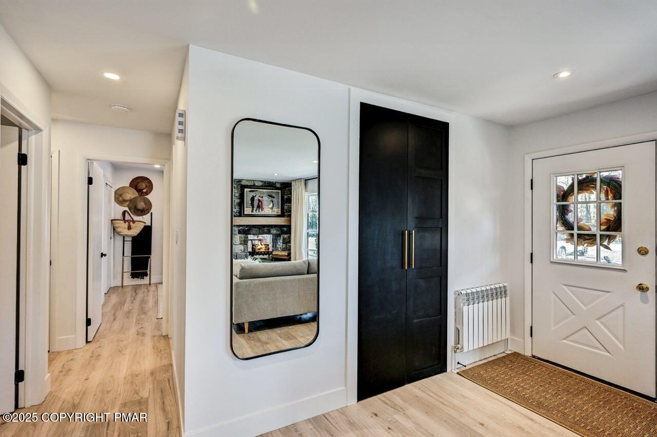 205 Winona Road Mount Pocono, PA 18344 - Photo 16 of 47 a bedroom with closet and wooden floor