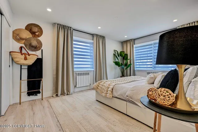 a bedroom with a bed and a chair