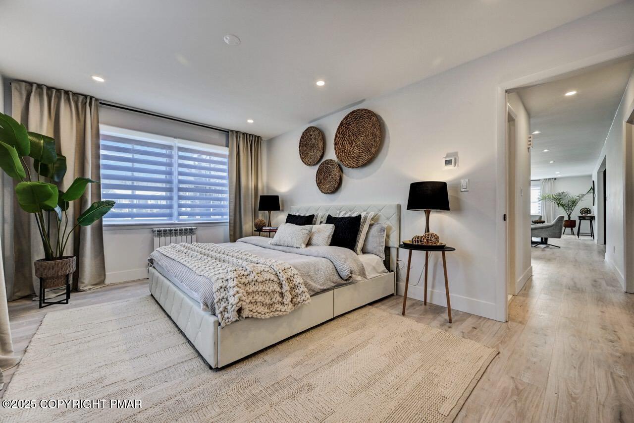 205 Winona Road Mount Pocono, PA 18344 - Photo 19 of 47 a bedroom with bed and a large window