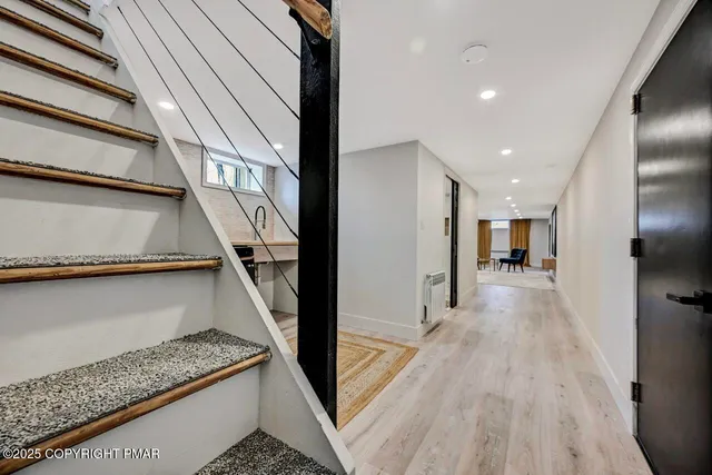 a living room with furniture and painting on the wall