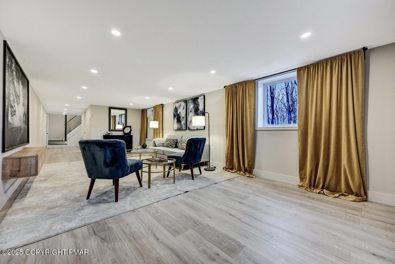 205 Winona Road Mount Pocono, PA 18344 - Photo 34 of 47 a living room with furniture and a wooden floor