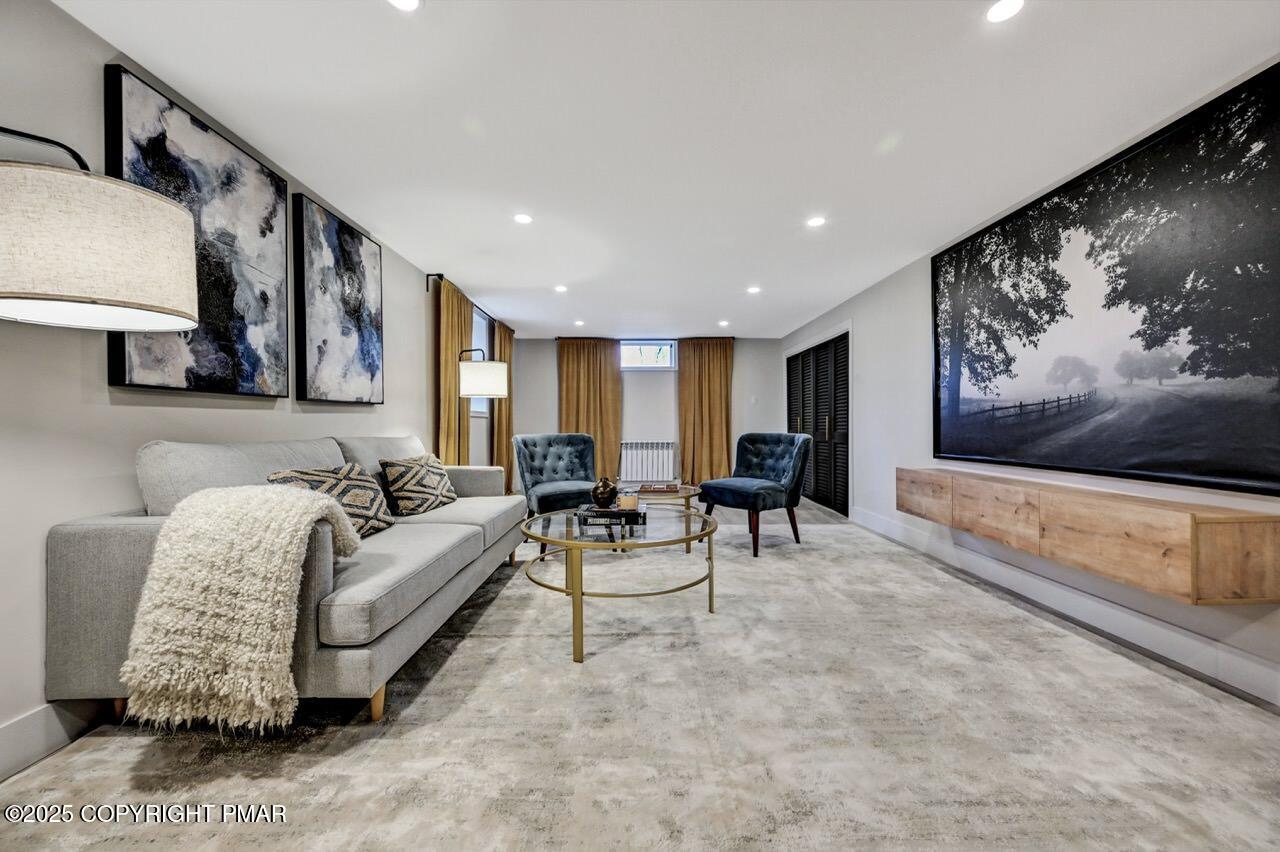 205 Winona Road Mount Pocono, PA 18344 - Photo 36 of 47 a living room with furniture and painting on the wall