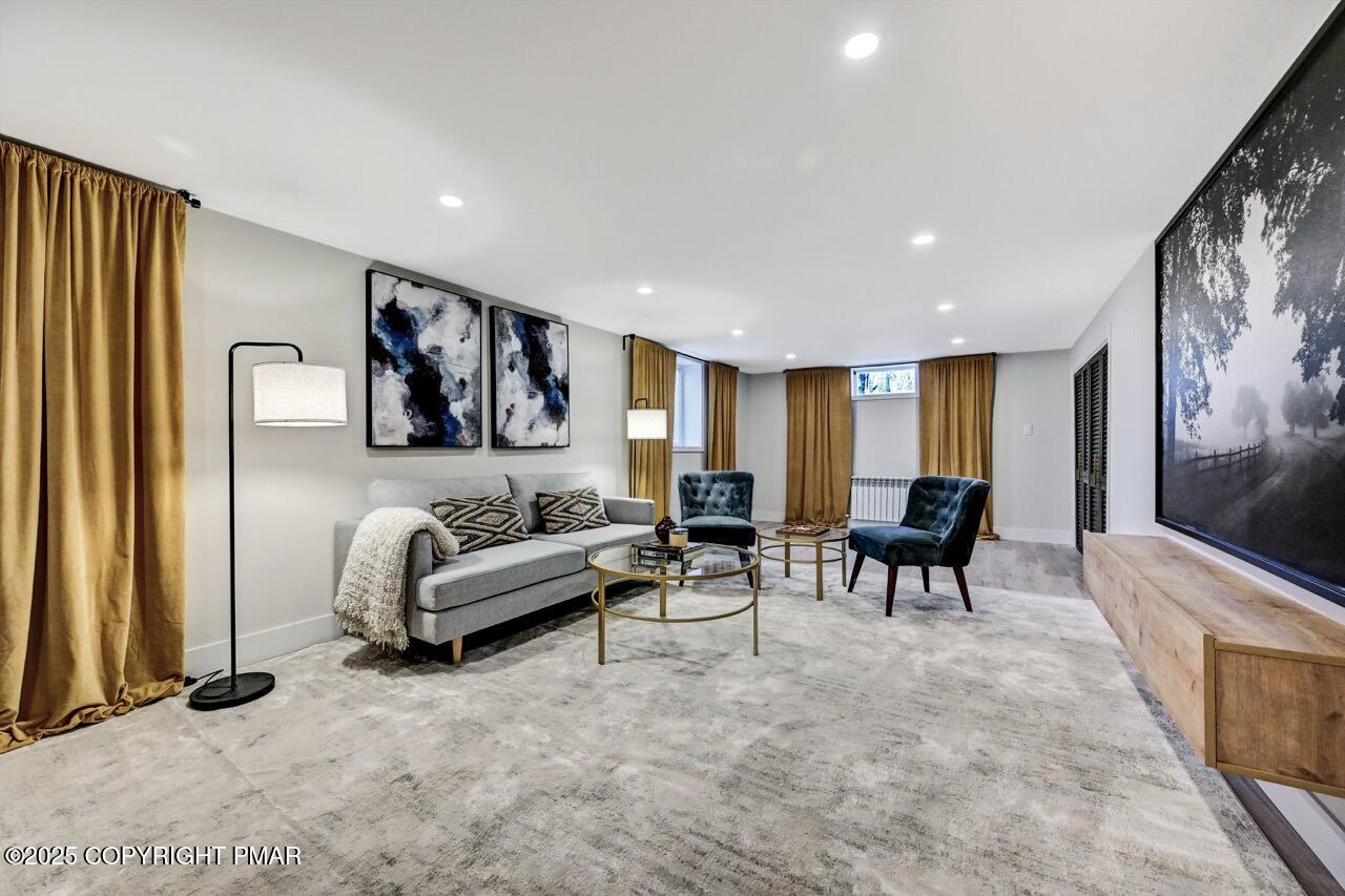 205 Winona Road Mount Pocono, PA 18344 - Photo 37 of 47 a living room with furniture and a flat screen tv