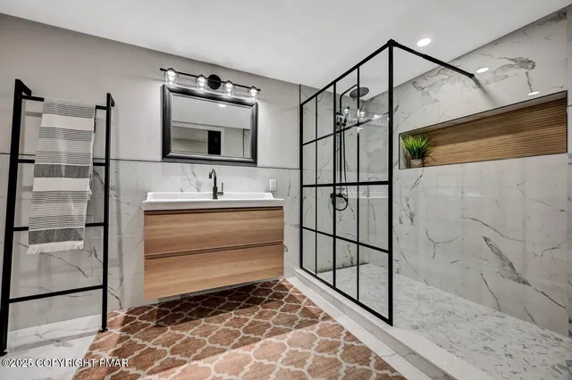 a kitchen with stainless steel appliances granite countertop a stove a refrigerator and a microwave