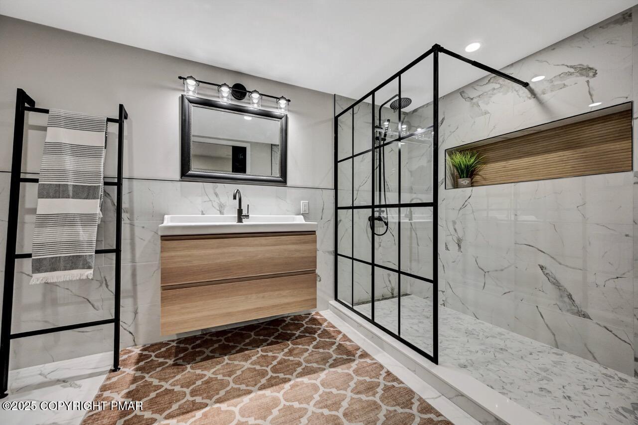 205 Winona Road Mount Pocono, PA 18344 - Photo 38 of 47 a bathroom with a sink and a mirror