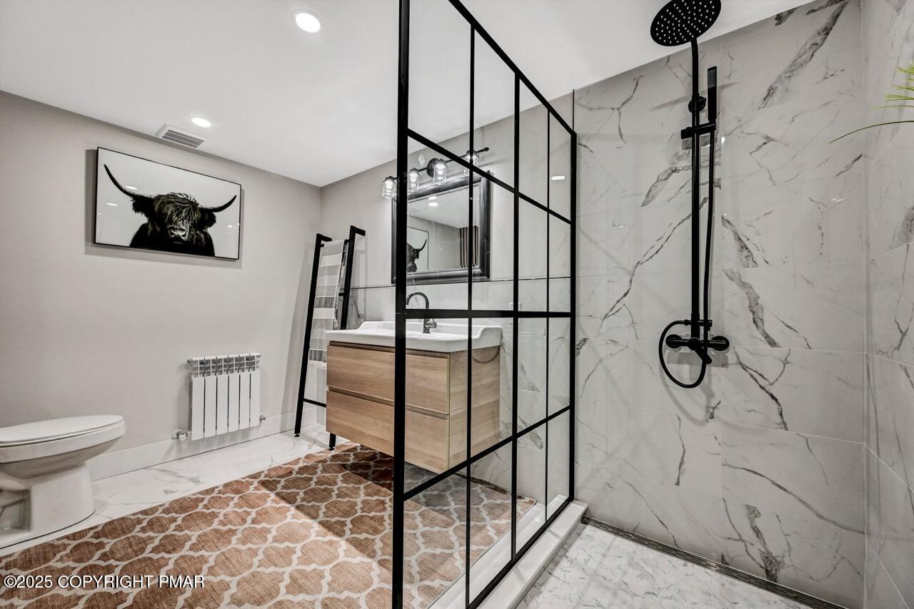 205 Winona Road Mount Pocono, PA 18344 - Photo 39 of 47 a bathroom with a shower and toilet