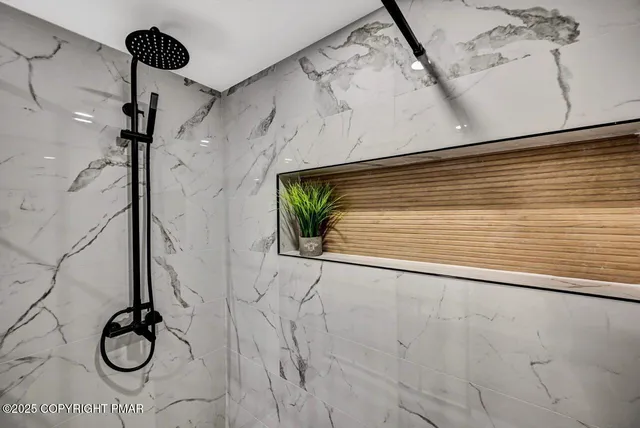 a view of a patio with table and chairs with wooden floor and fence