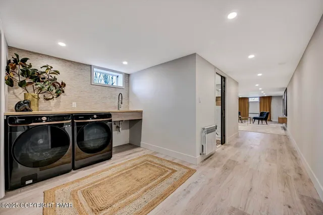 a view of patio with couches and a fire pit