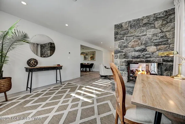 a workspace with furniture and a fireplace