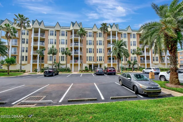 a view of a building with a yard