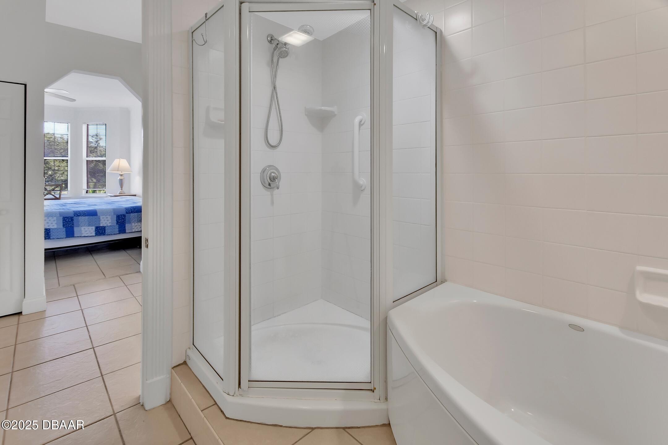4623 Rivers Edge Village Lane, Unit 6308 Ponce Inlet, FL 32127 - Photo 14 of 55 a bathroom with a tub and shower