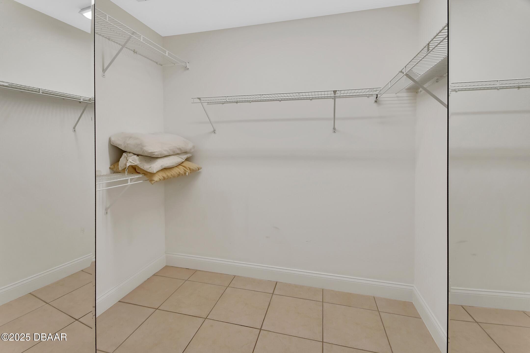 4623 Rivers Edge Village Lane, Unit 6308 Ponce Inlet, FL 32127 - Photo 16 of 55 a view of a room with racks on the wall