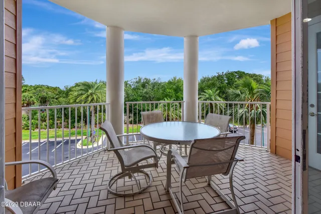 a white bath tub sitting next to a toilet