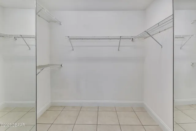 a view of a patio with table and chairs