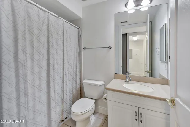 a view of a patio with table and chairs and potted plants