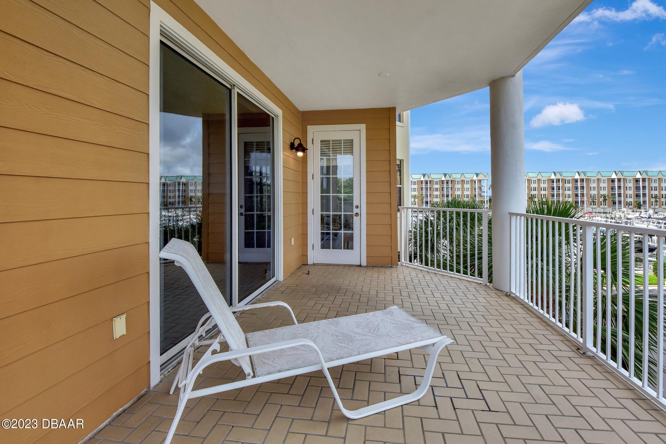 4623 Rivers Edge Village Lane, Unit 6308 Ponce Inlet, FL 32127 - Photo 28 of 55 a view of balcony with furniture