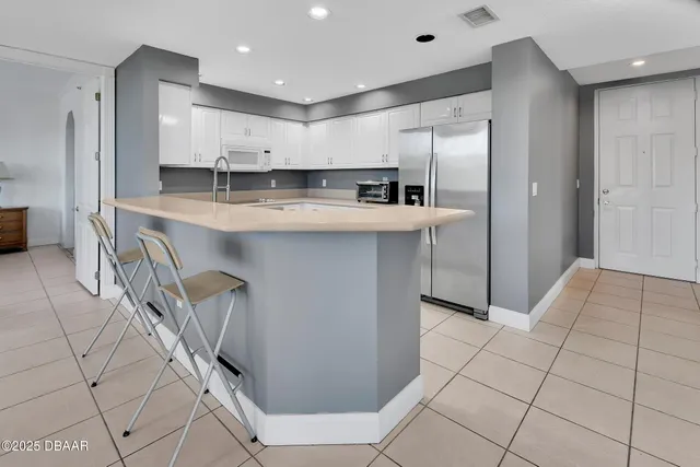 a bathroom with a shower and a glass door
