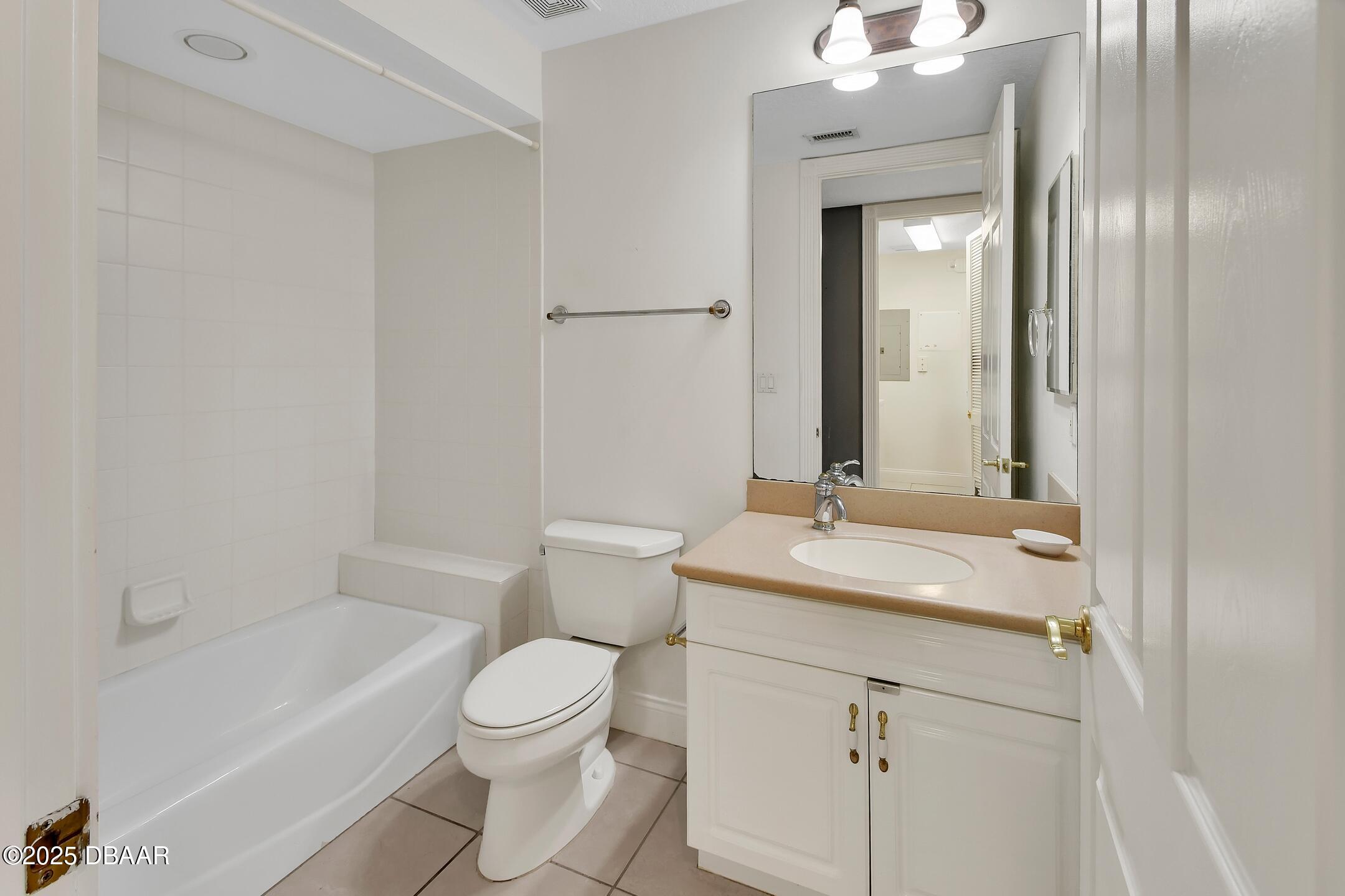 4623 Rivers Edge Village Lane, Unit 6308 Ponce Inlet, FL 32127 - Photo 37 of 55 a bathroom with a sink and a mirror