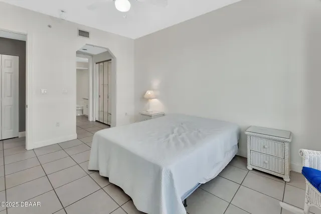 a building outdoor space with patio furniture and garden