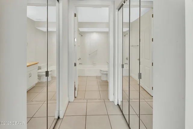 a view of a balcony with wooden floor