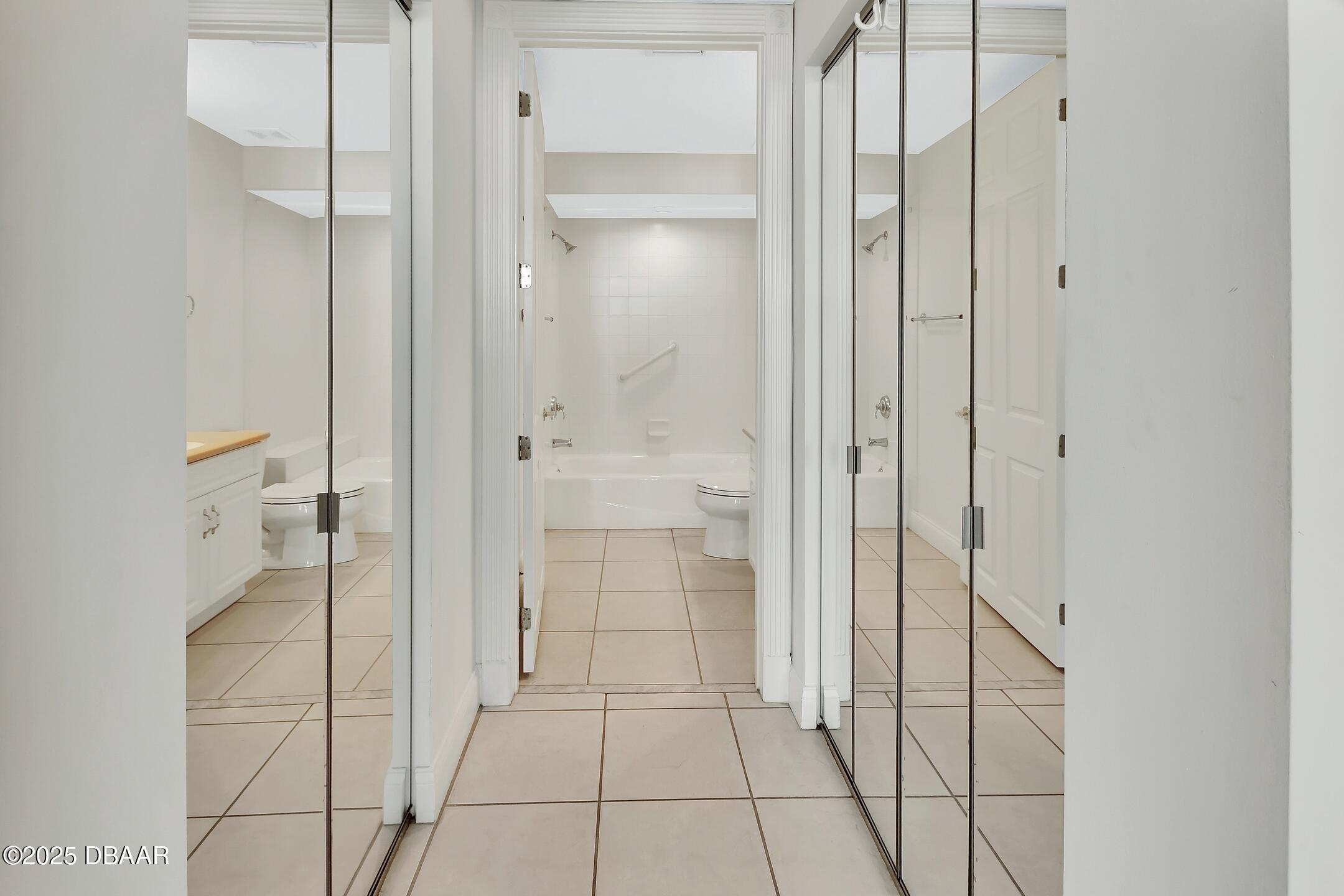 4623 Rivers Edge Village Lane, Unit 6308 Ponce Inlet, FL 32127 - Photo 40 of 55 a bathroom with a shower and a glass door