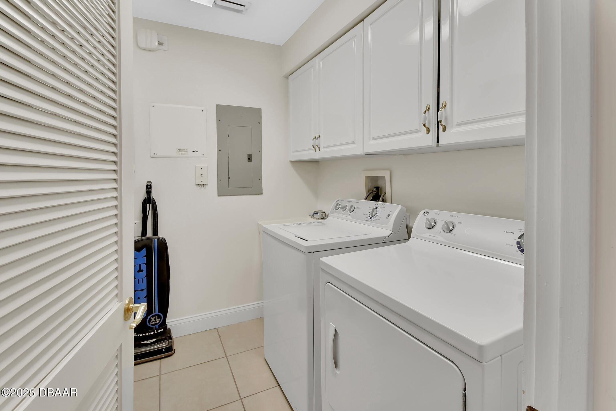 4623 Rivers Edge Village Lane, Unit 6308 Ponce Inlet, FL 32127 - Photo 44 of 55 a utility room with dryer and washer