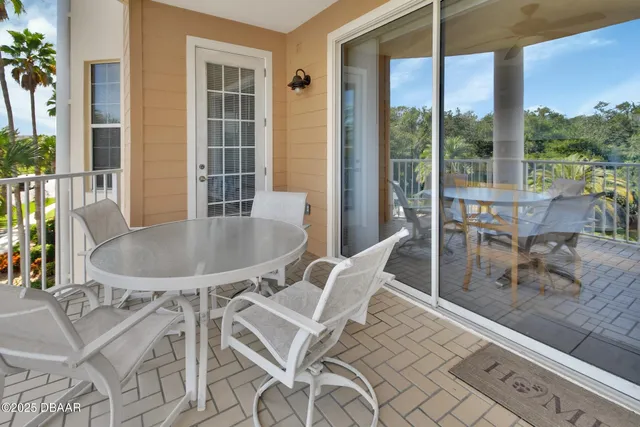 a view of a swimming pool with lounge chairs