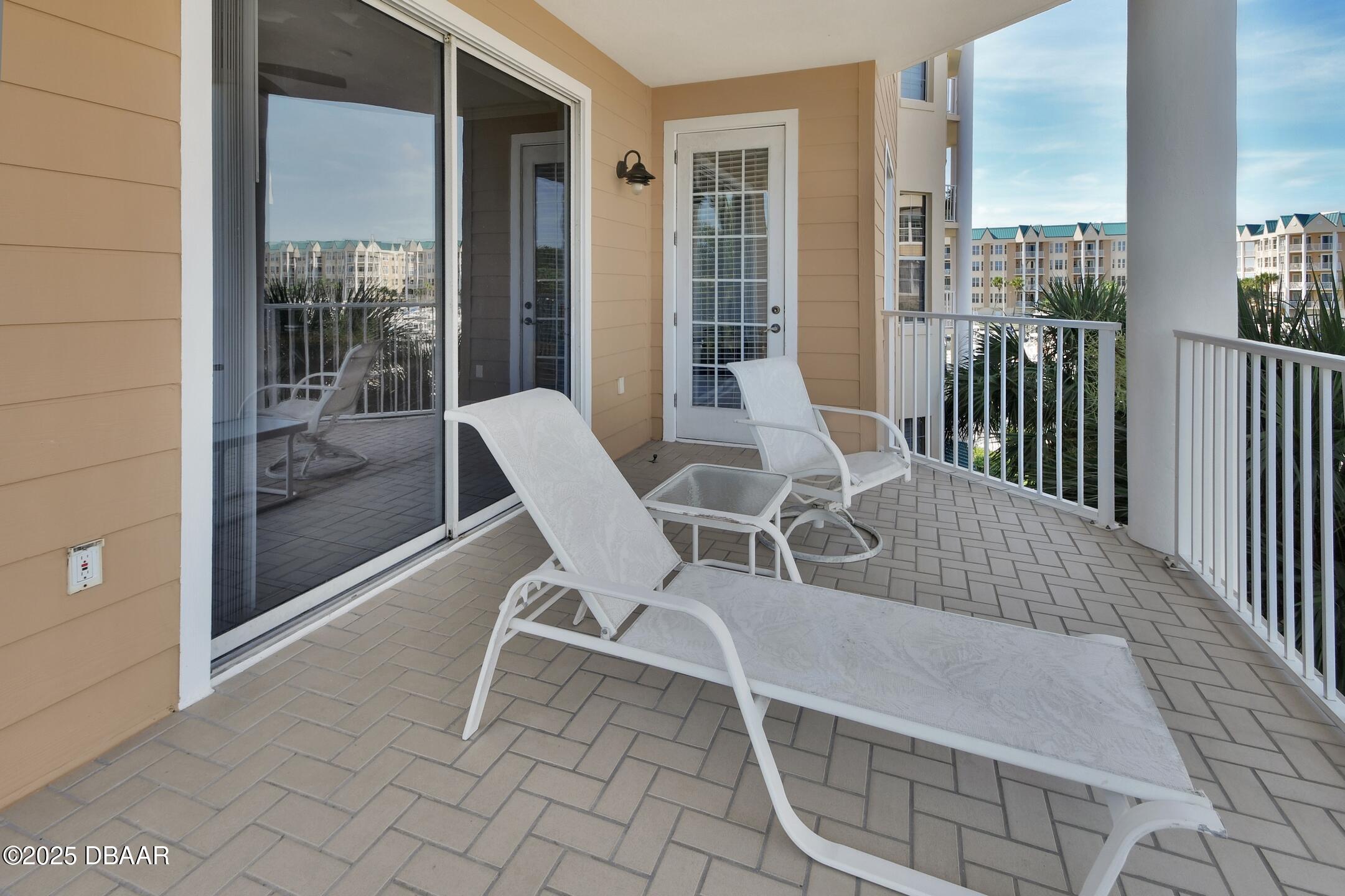 4623 Rivers Edge Village Lane, Unit 6308 Ponce Inlet, FL 32127 - Photo 48 of 55 a building outdoor space with patio furniture and garden