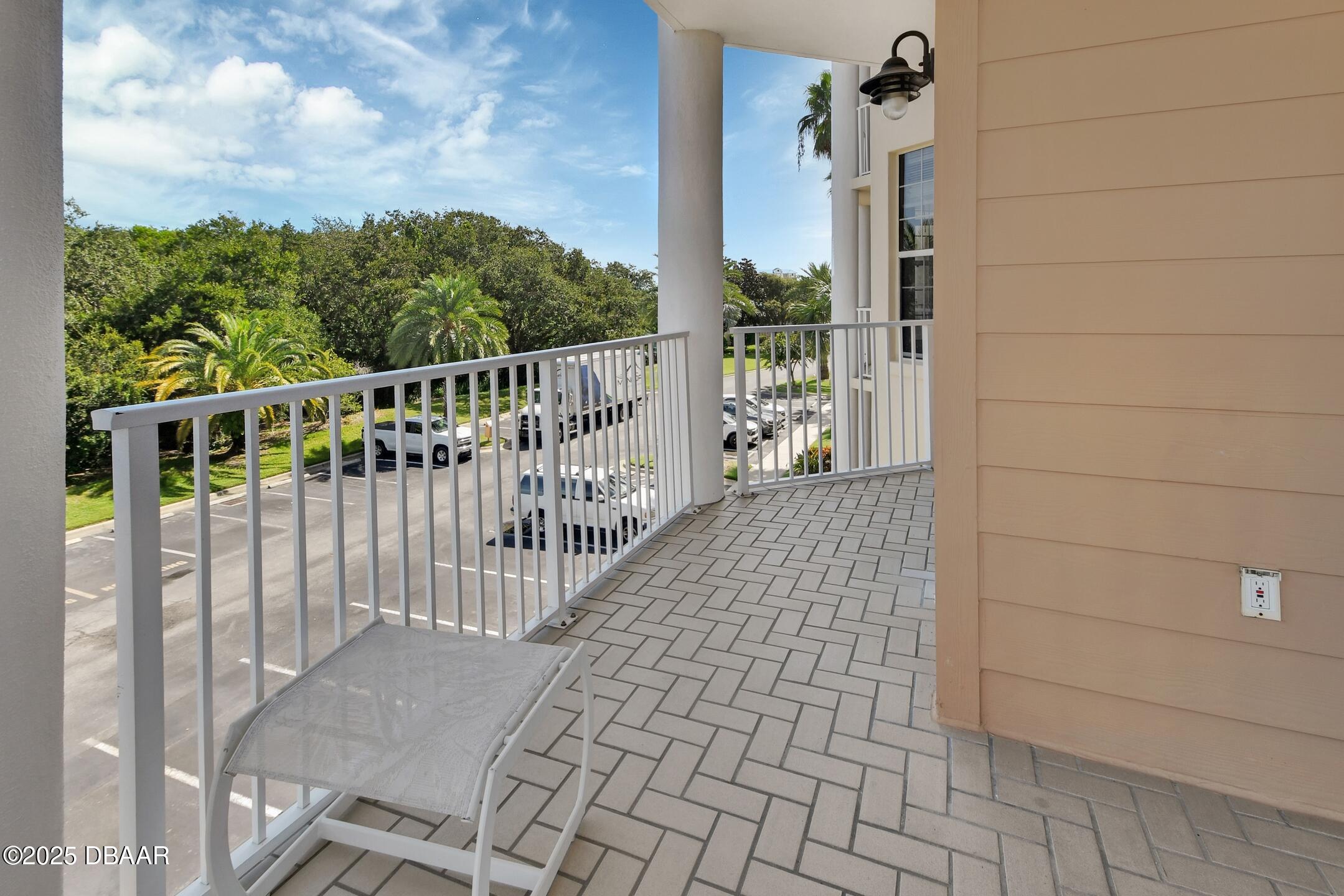 4623 Rivers Edge Village Lane, Unit 6308 Ponce Inlet, FL 32127 - Photo 49 of 55 a view of a balcony with wooden floor