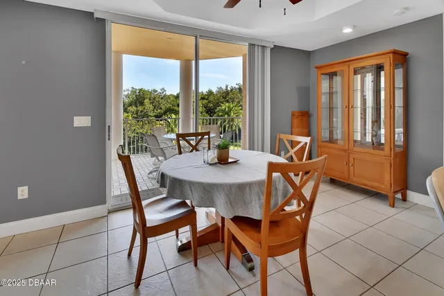 a view of a dining room with furniture window and outside view