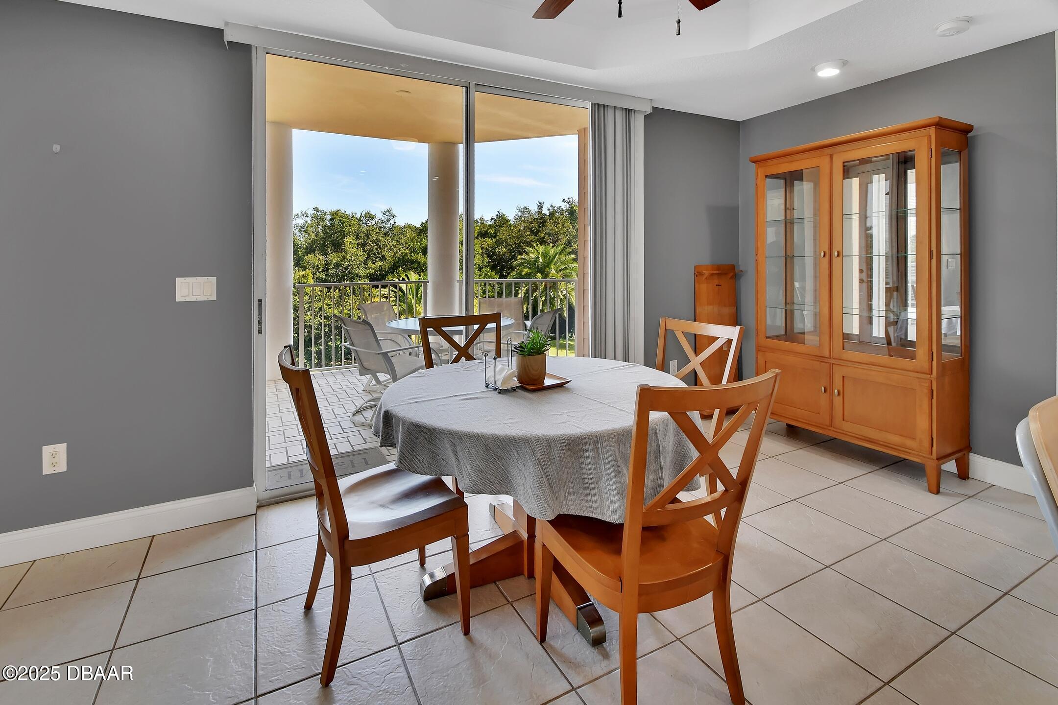 4623 Rivers Edge Village Lane, Unit 6308 Ponce Inlet, FL 32127 - Photo 7 of 55 a view of a dining room with furniture window and outside view