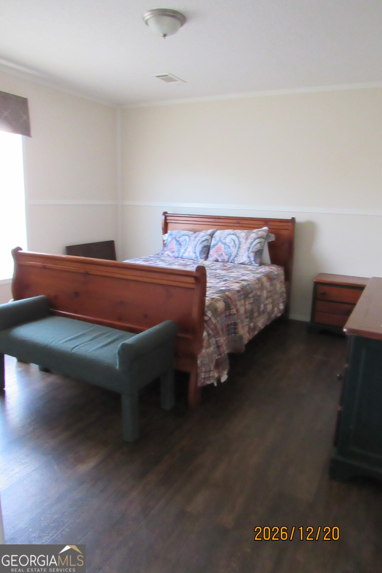 98 Lookout Trail Sparta, GA 31087 - Photo 6 of 10 a bed sitting in a bedroom next to a window