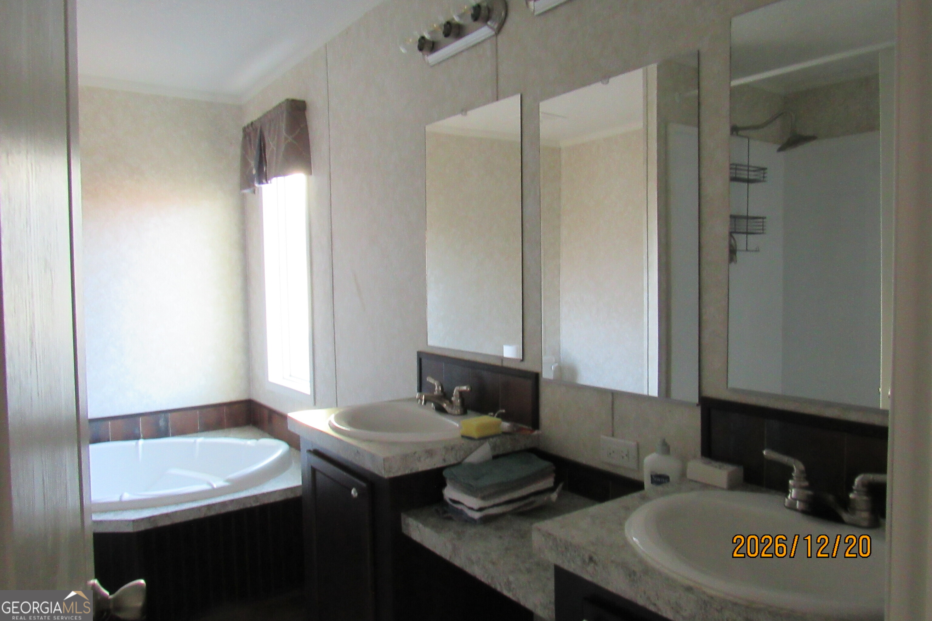 98 Lookout Trail Sparta, GA 31087 - Photo 8 of 10 a bathroom with a sink and a mirror