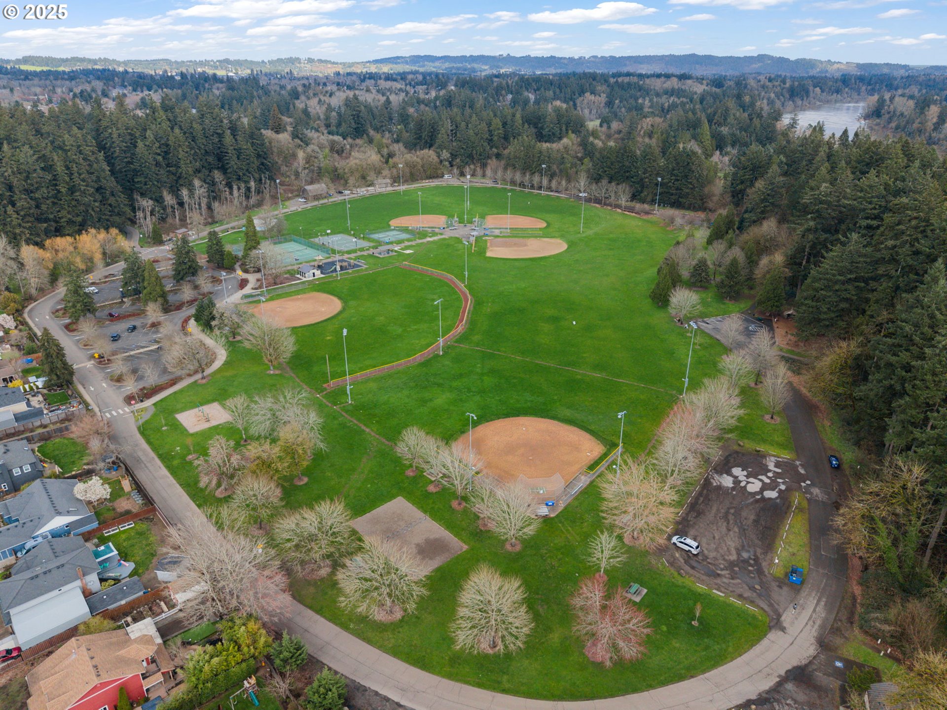 30406 Southwest Ruth Street, Unit 78 Wilsonville, OR 97070 - Photo 39 of 45 a view of a lake in middle of the green field